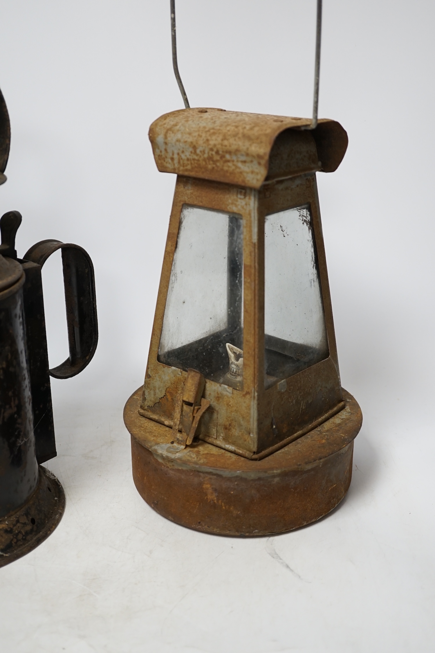 Two late 19th / early 20th century Sherwoods railway lamps, largest 34cm high. Condition - fair, rust and wear to both